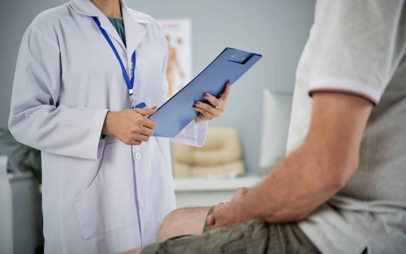 Medical practitioner asking patient questions from the list